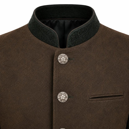 Close-up of a brown textured jacket with a dark green embroidered mandarin collar and decorative silver-tone buttons.