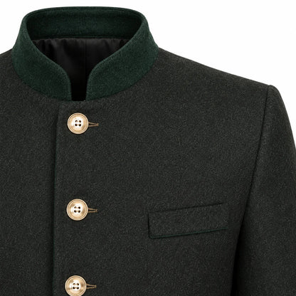 Close-up of a dark charcoal gray wool-blend jacket with a contrasting dark green mandarin collar, gold-tone buttons, and a welt pocket on the chest.