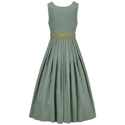 Green dress with a gold belt on a white background