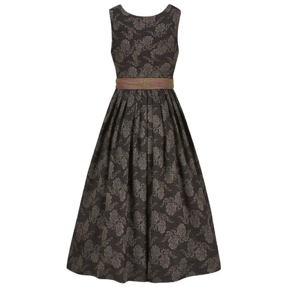 Black floral patterned dirndl dress with a brown belt on a white background