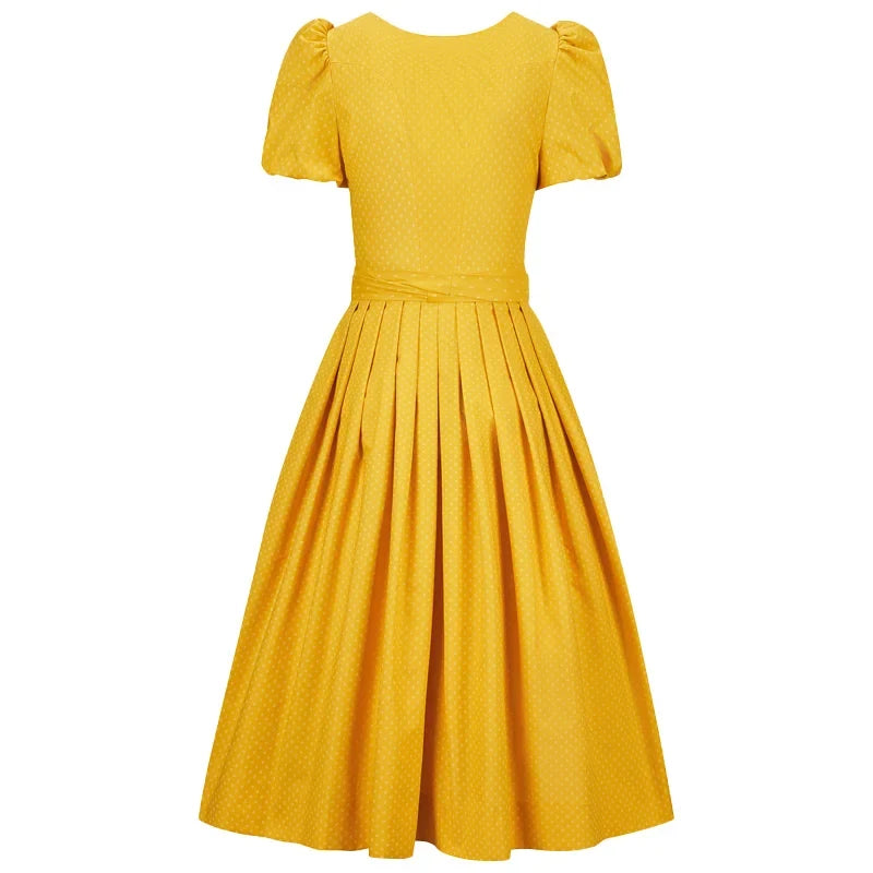 Yellow dress with puff sleeves on a white background