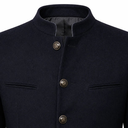 Close-up of a dark navy blue jacket with a mandarin collar, three front buttons, and welt pockets on a white background.