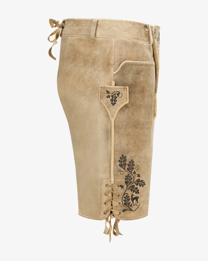Beige leather shorts with decorative stitching on a white background
