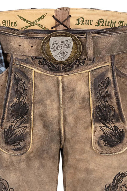 Brown leather pants with decorative stitching and a belt buckle on a white background