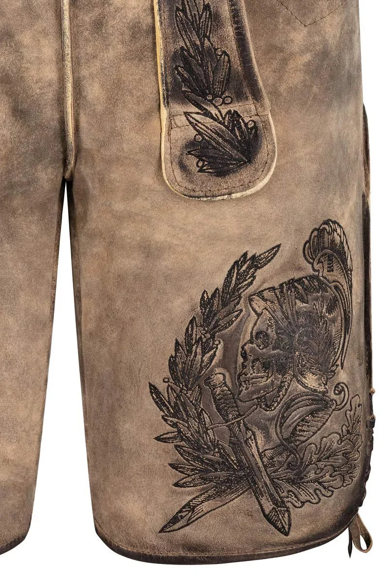 Close-up of a brown leather glove with intricate black embossed design on a white background