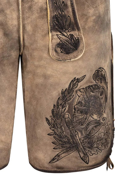 Close-up of a brown leather glove with intricate black embossed design on a white background