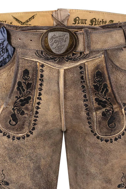 Traditional Bavarian lederhosen with decorative stitching and a brand logo on a white background