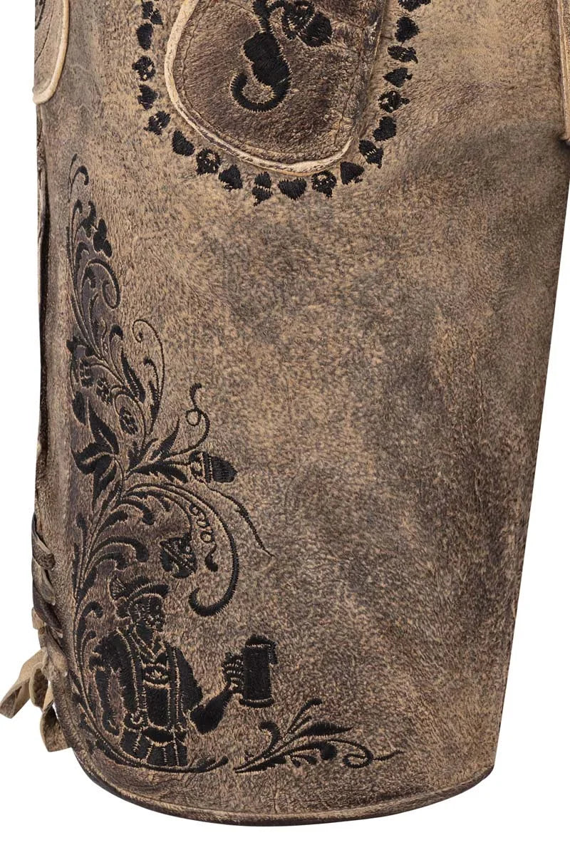Brown leather bag with intricate black embossed designs on a white background