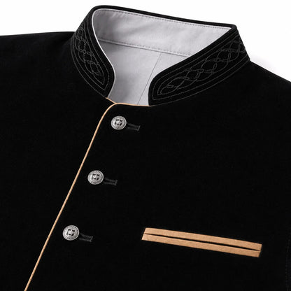 Close-up of a black traditional-style jacket with a stand collar, decorative embroidered trim, silver buttons, and a diagonal welt pocket with tan piping on a white background.