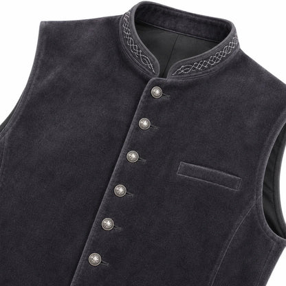 A close-up of a dark charcoal gray velvet vest with a mandarin collar, decorative embroidered trim, and silver-toned buttons down the front.