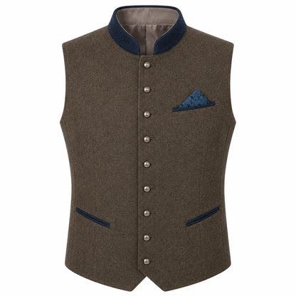 A men's waistcoat vest in textured brown wool with dark navy blue trim on the collar, pocket flaps, and button placket, featuring a matching patterned blue pocket square.