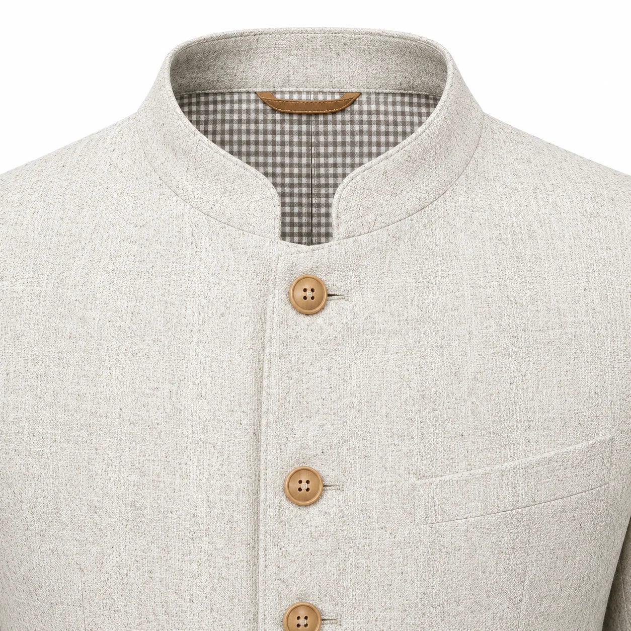 Close-up of a light beige textured jacket with a mandarin collar, three wooden buttons, and a gingham lining visible inside the collar.