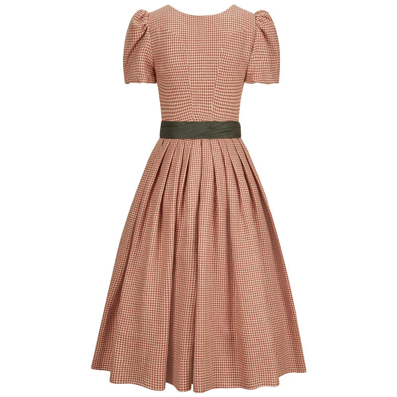 Brown checkered dress with a green belt on a white background
