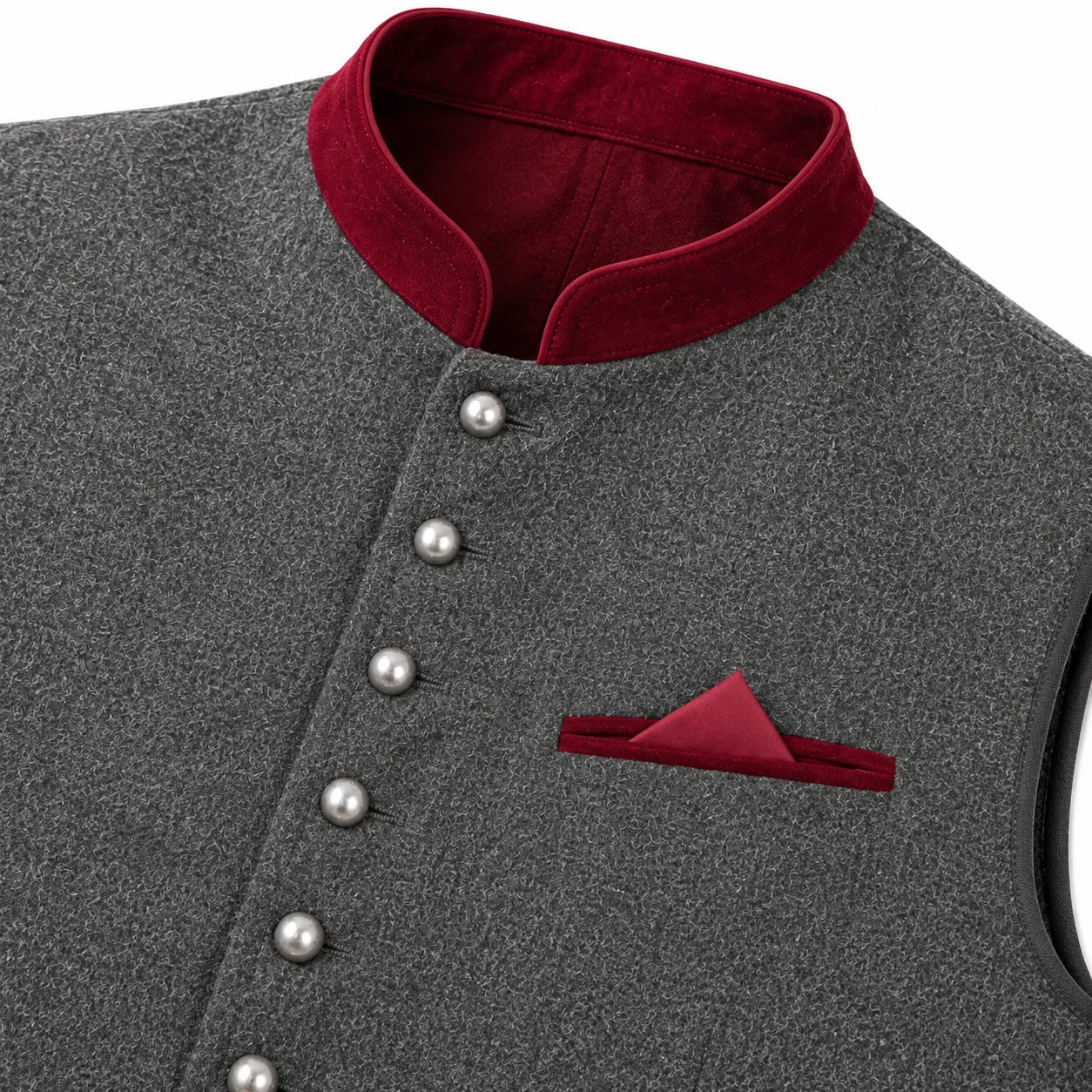 Close-up of a dark gray textured waistcoat with a contrasting deep red velvet stand collar, decorative silver buttons, and a matching red pocket square.