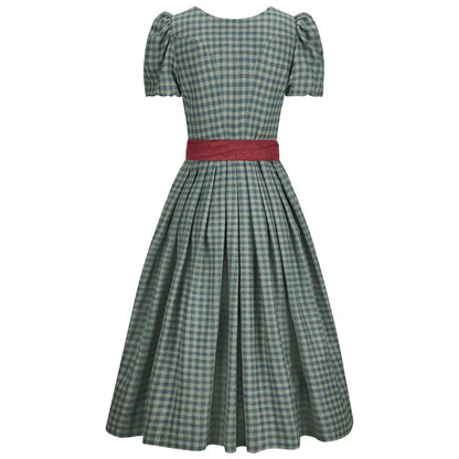 Green checkered dress with a red belt on a white background