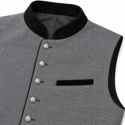 A close-up of a gray textured waistcoat with a black velvet collar, sleeve trim, and a matching black chest pocket, accented by decorative silver-tone buttons.