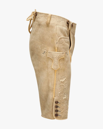 Beige leather pants with decorative stitching and buttons on a white background