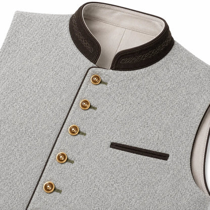 Close-up of a light gray textured waistcoat with a dark brown mandarin collar, gold-tone buttons, and a matching dark brown pocket trim on a white background.
