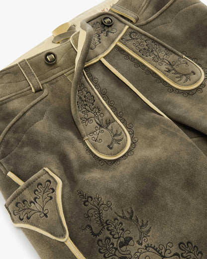 Brown leather pants with decorative stitching on a white background