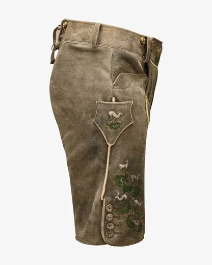 Brown leather pants with embroidered designs on a white background