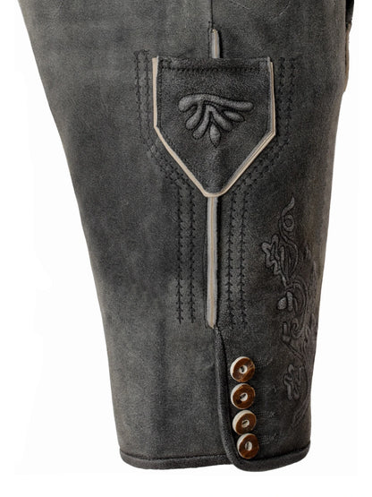 Close-up of gray leather pants with decorative stitching and buttons on a white background