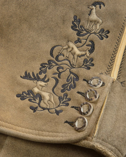 Embroidered design on a beige fabric with animals and leaves.