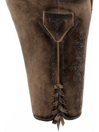 Brown leather boot with lace-up design and floral embroidery on a white background