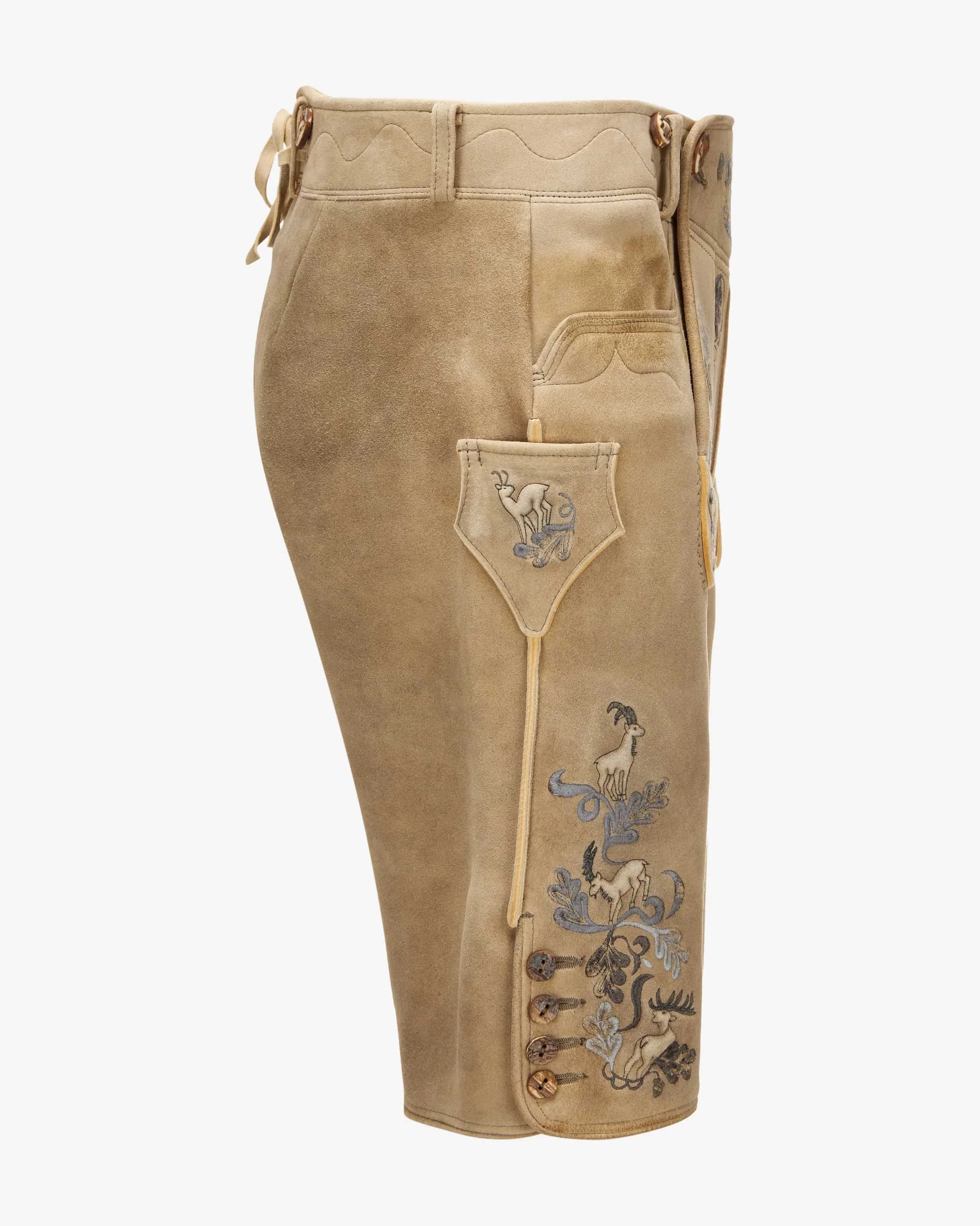 Brown leather pants with embroidered designs on a white background