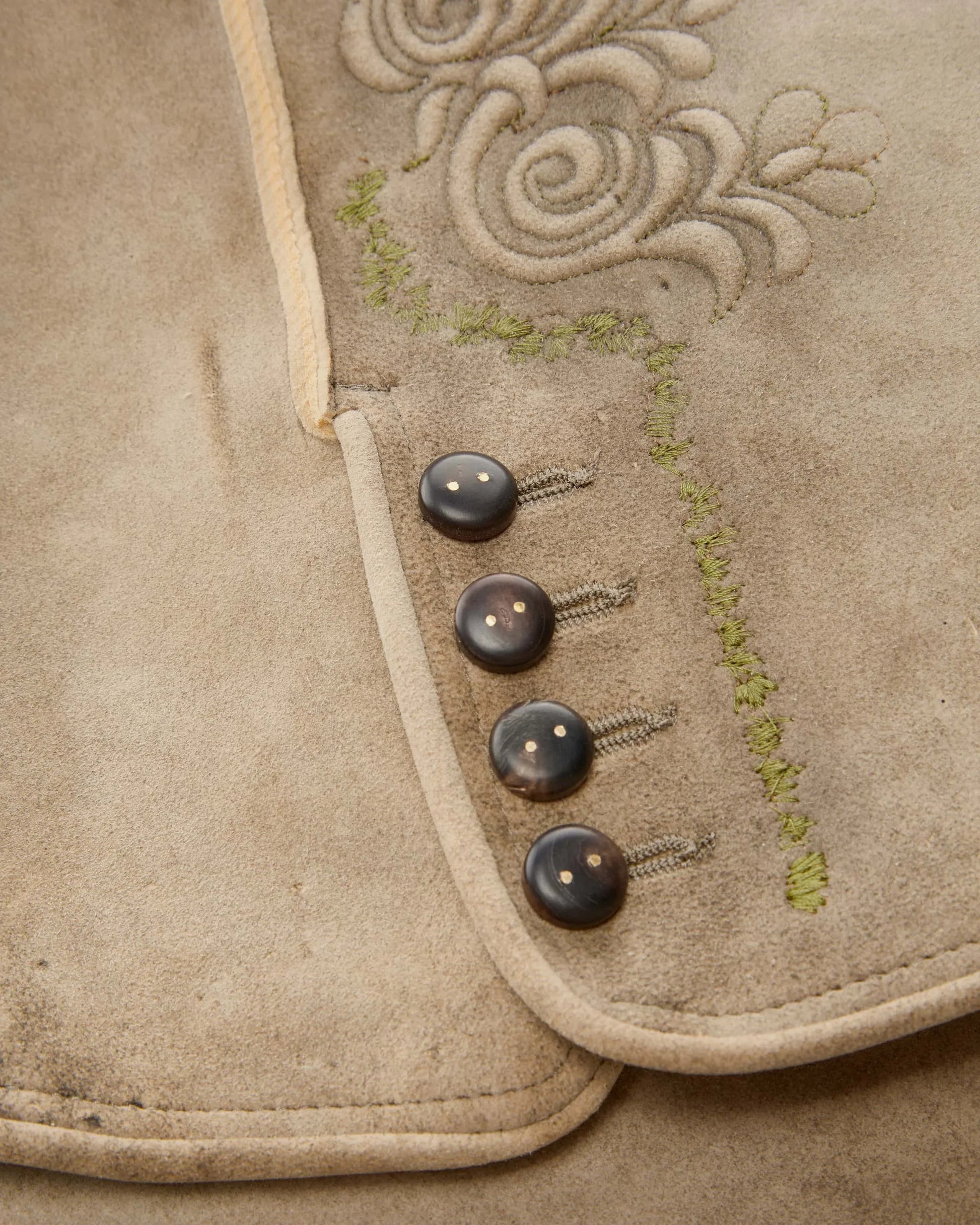 Traditional German lederhosen with embroidery on a white background