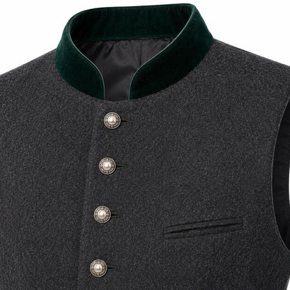 Close-up of a dark gray textured waistcoat with a contrasting dark green velvet stand collar and decorative silver-tone buttons.