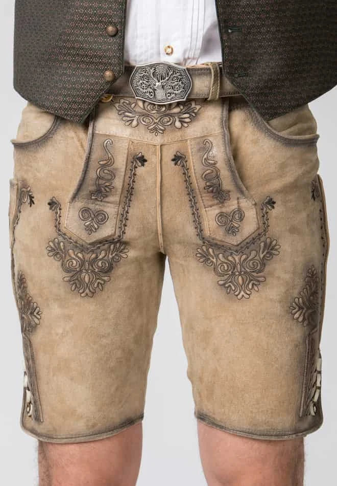 Traditional Bavarian lederhosen with intricate embroidery on a plain background