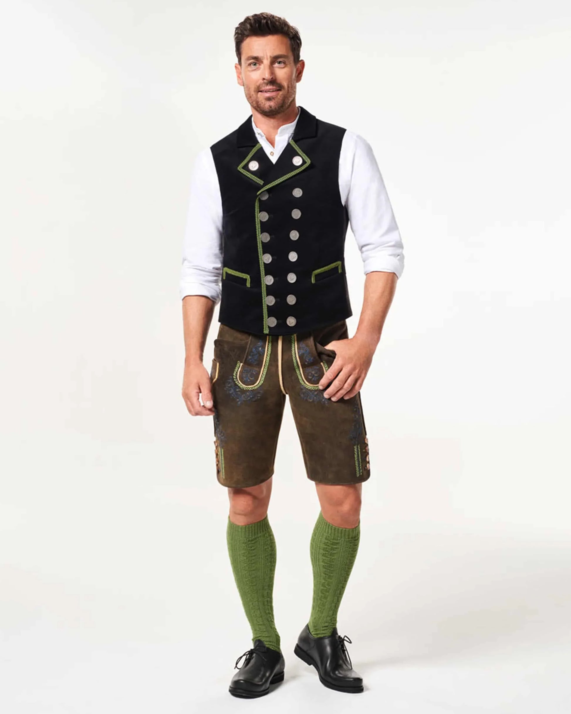 Man wearing traditional Bavarian clothing on a white background