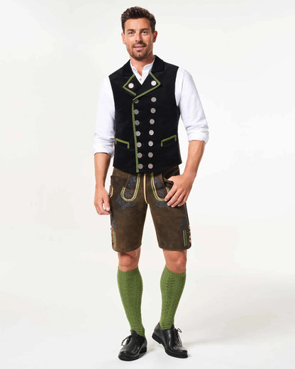 Man wearing traditional Bavarian clothing on a white background