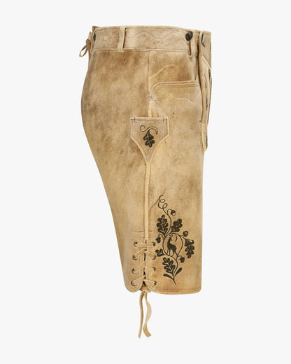 Beige leather shorts with floral embroidery on a white background
