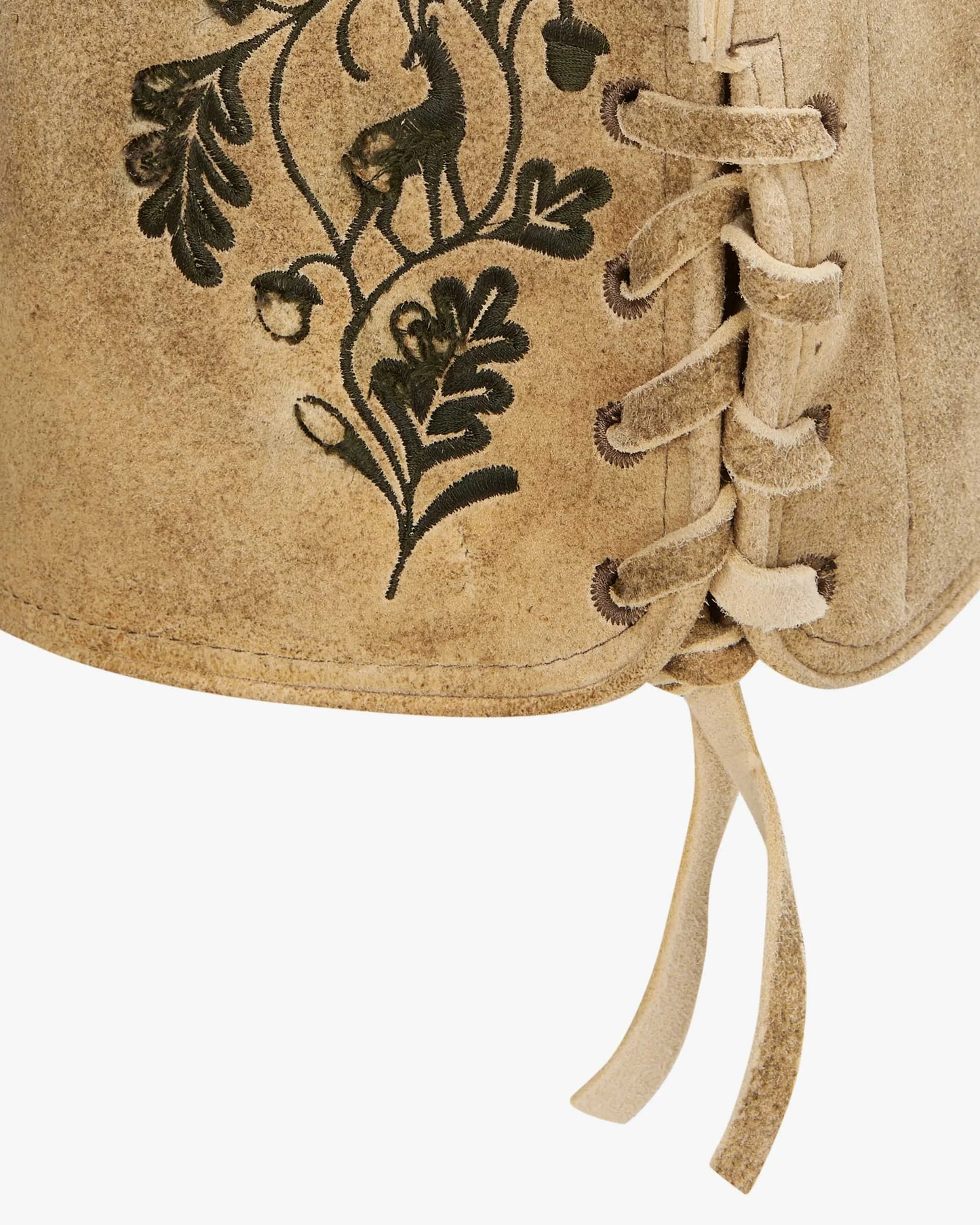 Close-up of a brown leather vest with black embroidered designs
