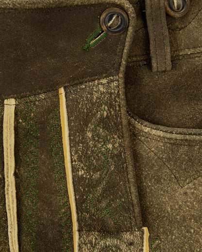 Close-up of a brown leather boot with stitching details